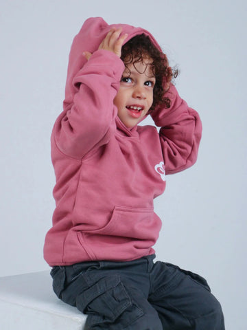 Happy child wearing Antooz Froggie Hoodie in soft pink, showcasing comfort and playful style for little ones.